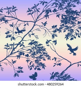 The branches of the trees, the birds, the sky. seamless pattern