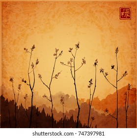 Branches of young trees with fresh leaves on vintage background. Traditional oriental ink painting sumi-e, u-sin, go-hua. Hieroglyph - well-being