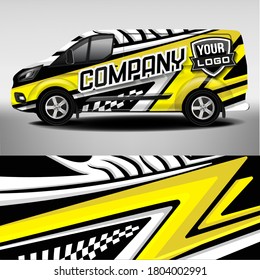 Branded car sticker in yellow and black colors. Car design development for the company. Car branding.
