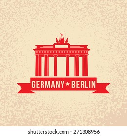 Brandenburg gate - the symbol of Berlin, Germany. Vintage stamp with red ribbon.