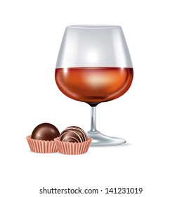 brandy glass and chocolate candy isolated