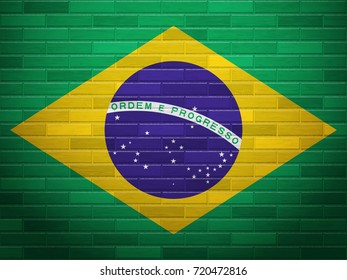 Brasil flag on textured brick wall.