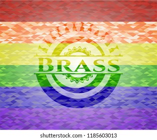 Brass emblem on mosaic background with the colors of the LGBT flag
