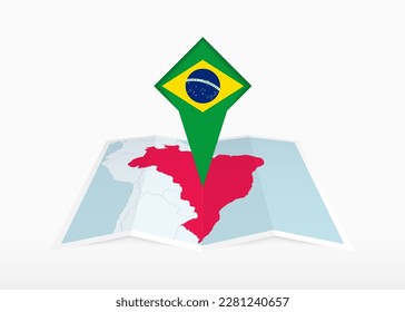 Brazil is depicted on a folded paper map and pinned location marker with flag of Brazil. Folded vector map.