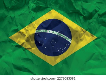 Brazil flag crumpled paper background.
