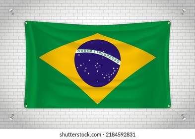Brazil flag hanging on brick wall. 3D drawing. Flag attached to the wall. Neatly drawing in groups on separate layers for easy editing.