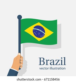 Brazil flag holding in hand. Brazil Independence Day 7 september. Vector illustration flat design. Isolated on white background. National holiday. Celebrated annually. Waving flag in wind.
