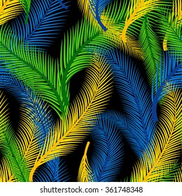 The Brazilian background from feathers in the Brazilian ethnic color. Seamless pattern. Carnival background on the black.