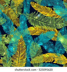 The Brazilian background from feathers in the Brazilian ethnic color. Seamless pattern. Carnival background on the dark.