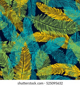 The Brazilian background from feathers in the Brazilian ethnic color. Seamless pattern. Carnival background on the dark.