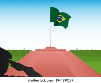 The Brazilian flag flies above the pole in the image of a soldier saluting the flag