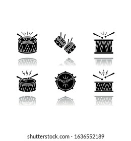Brazilian music drop shadow black glyph icons set. Drums with drumsticks. Samba. Musical instrument. Brazilian carnival. Festive drum parade. Isolated vector illustrations on white space