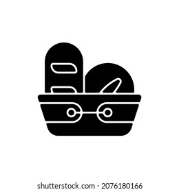 Bread basket black glyph icon. Container for storing bakery products. Specialy designed kitchen equipment. Dinnerware for everyday usage. Silhouette symbol on white space. Vector isolated illustration