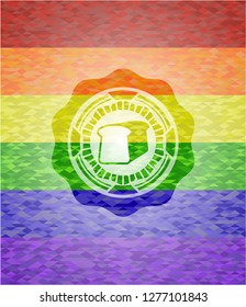 bread icon inside emblem on mosaic background with the colors of the LGBT flag