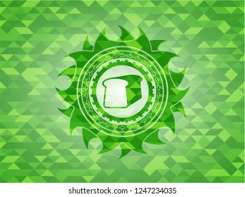 bread icon inside green emblem with mosaic ecological style background