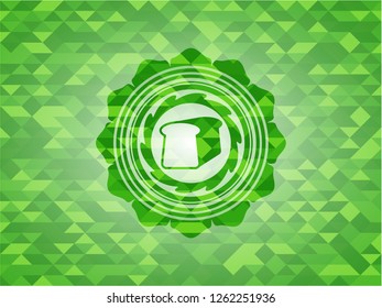 bread icon inside green emblem with triangle mosaic background