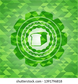 bread icon inside green emblem with mosaic ecological style background