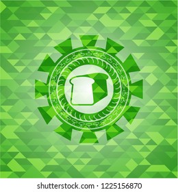 bread icon inside realistic green emblem. Mosaic background