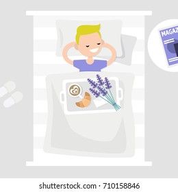 Breakfast in bed. Top view. Coffee, croissant and a bouquet of lavender flowers on a tray. Romantic relationships concept. Young character lying in bed. Flat 2.0 editable vector illustration, clip art
