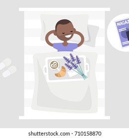 Breakfast in bed. Top view. Coffee, croissant and a bouquet of lavender flowers on a tray. Romantic relationships concept. Young character lying in bed. Flat 2.0 editable vector illustration, clip art