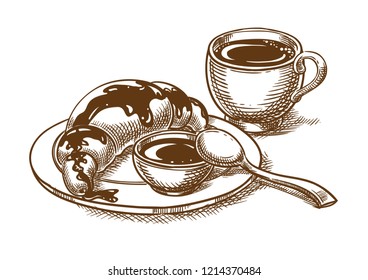 Breakfast with a cup of coffee and a croissant