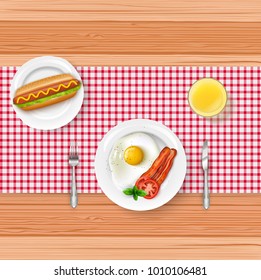 Breakfast menu with fried egg and fast food on wooden table