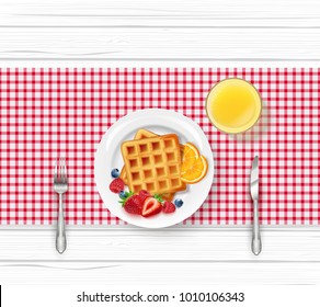 Breakfast menu with waffles and berries on wooden table