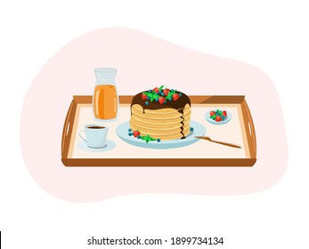 Breakfast on a tray. Pancakes with berries, a cup of coffee, orange juice, a plate of berries, strawberries, blueberries, mint