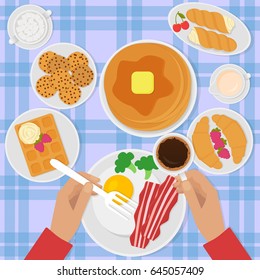 Breakfast top view vector illustration in flat style with scrambled eggs, bacon, pancakes, coffee and sweets.