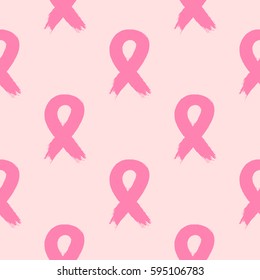 Breast cancer awareness ribbon. A seamless pattern painted with a rough brush. Grunge. Vector illustration.  Pink colour.