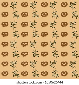 Bretzel and branches pattern on a yellow background. Pretzel and plants.