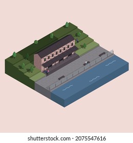 Brick building on the waterfront, river. people sit on the seafront.