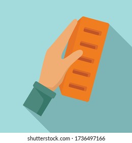 Icono de ladrillo en la mano. Ilustración plana de ladrillo en el icono vector de mano para el diseño web