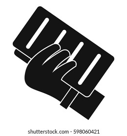 Brick in a hand icon. Simple illustration of brick in a hand vector icon for web