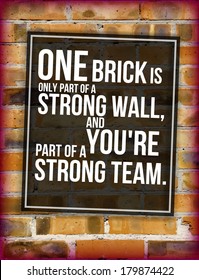 Brick wall with team building phrase