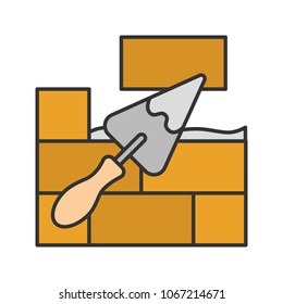 Brick wall with triangular shovel color icon. Putty knife, spatula. Cement solution. Isolated vector illustration