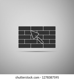 Brick wall with trowel icon isolated on grey background. Flat design. Vector Illustration
