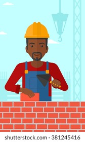 Bricklayer with spatula and brick.