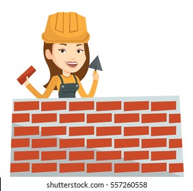 Bricklayer in uniform and helmet. Caucasian bicklayer working with spatula and brick on construction site. Bricklayer building brick wall. Vector flat design illustration isolated on white background.