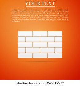 Bricks icon isolated on orange background. Flat design. Vector Illustration