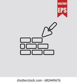 Brickwork and trowel icon in trendy isolated on grey background.Vector illustration.