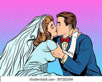 The bride and groom kiss