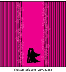 A bride and groom on their wedding day about to kiss in silhouette