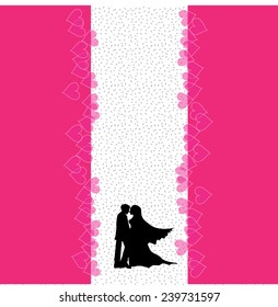 A bride and groom on their wedding day about to kiss in silhouette