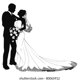 A bride and groom on their wedding day about to kiss in silhouette