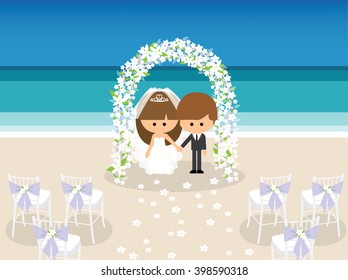 bride and groom under flower arch on the beach