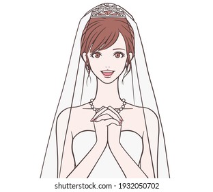Bride holding hands in front of her chest 