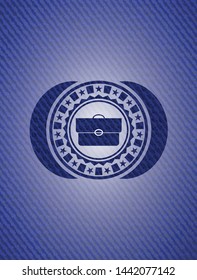 briefcase icon inside badge with denim texture
