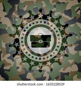 briefcase icon inside camouflage emblem