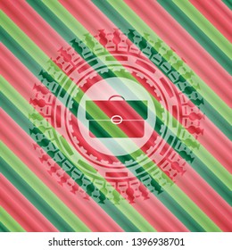 briefcase icon inside christmas colors emblem.